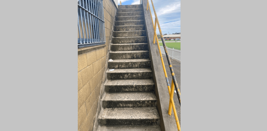 Concrete steps of grandstand before cleaning.