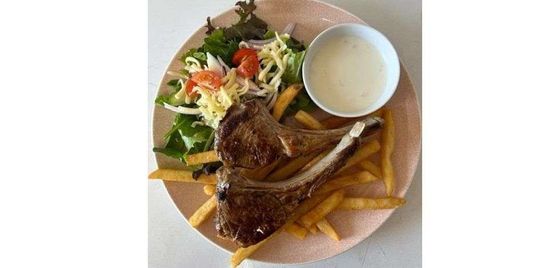 Lamb Cutlets with chips, salad and a dip.